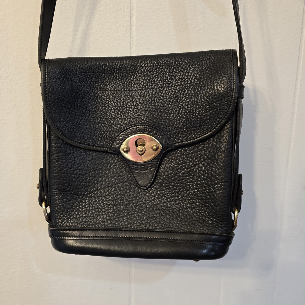 Vintage Dooney & Bourke Cavalry Trooper crossbody bag in black pebbled